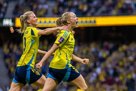 Sofia Jakobsson and Magdalena Eriksson of Sweden celebrate