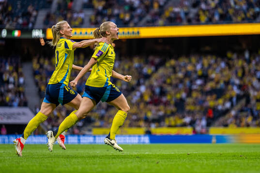 Sofia Jakobsson and Magdalena Eriksson of Sweden celebrate
