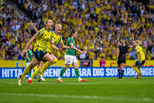 Sofia Jakobsson and Magdalena Eriksson of Sweden celebrate