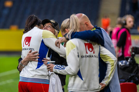 Goalkeeper Zecira Musovic celebrate with team manager
