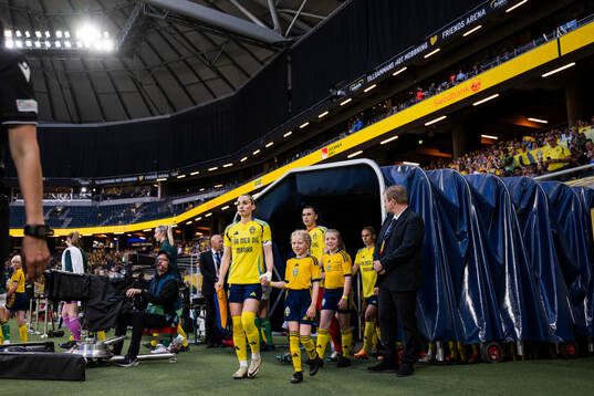 Kosovare Asllani and goalkeeper Zecira Musovic of Sweden