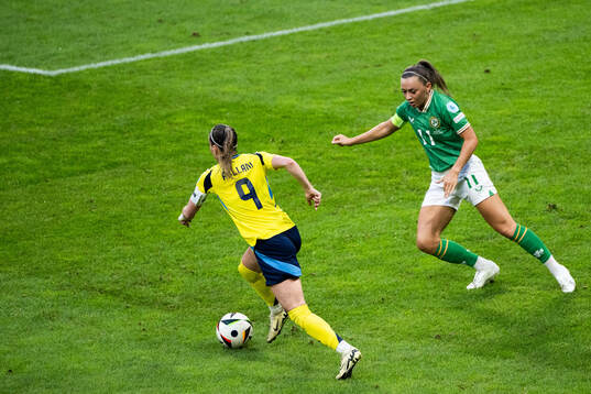 Kosovare Asllani of Sweden and Katie McCabe of Republic of