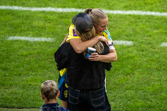 Magdalena Eriksson celebrates with team manager Marika