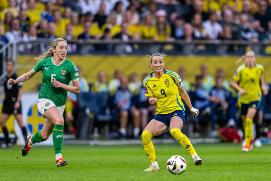 Megan Connolly of Republic of Ireland and Kosovare Asllani