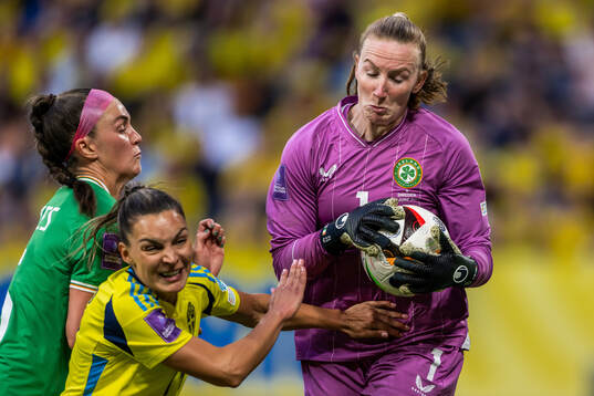 Johanna Rytting Kaneryd of Sweden and goalkeeper Courtney