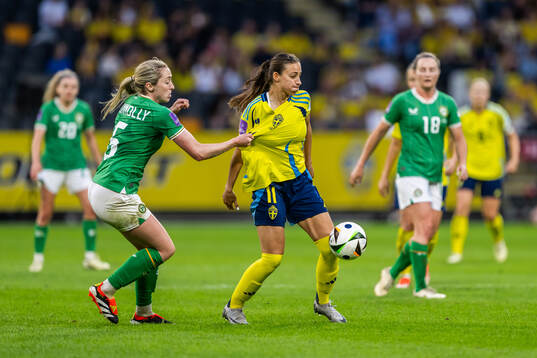 Megan Connolly of Republic of Ireland and Rosa Kafaji of