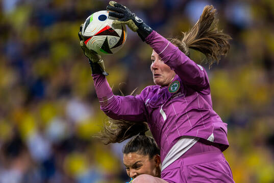 Johanna Rytting Kaneryd of Sweden and goalkeeper Courtney