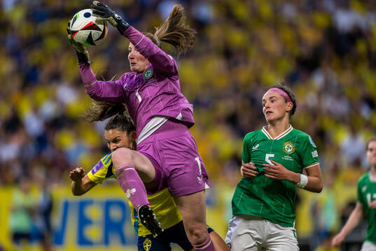 Johanna Rytting Kaneryd of Sweden and goalkeeper Courtney