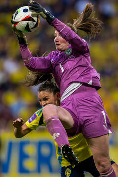 Johanna Rytting Kaneryd of Sweden and goalkeeper Courtney