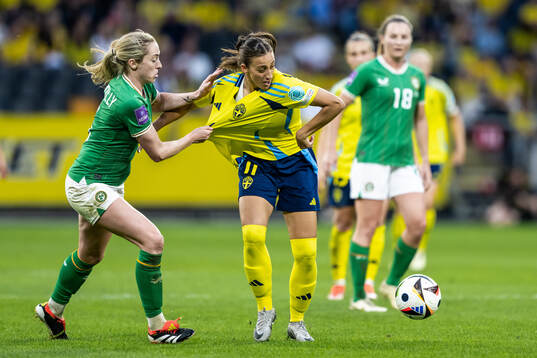 Megan Connolly of Republic of Ireland and Rosa Kafaji of