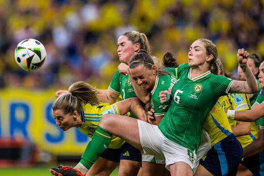 Linda Sembrant of Sweden competes for the ball with Megan