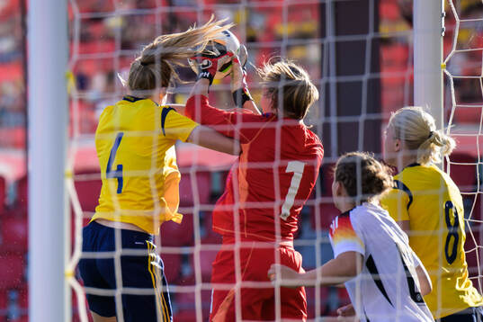 Ebba Handfast of Sweden and Goalkeeper Paula Hoppe of