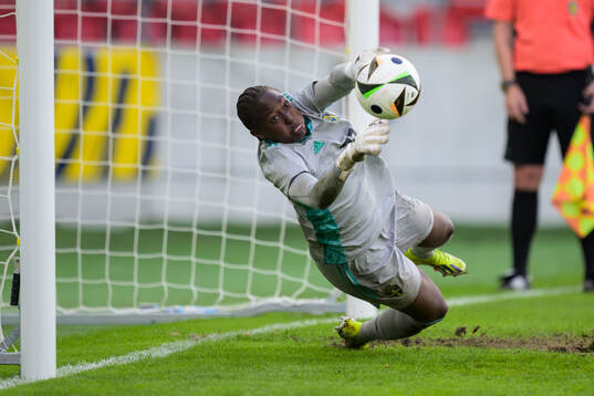 Goalkeeper Angel Mukasa of Sweden is saving a penalty