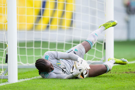 Goalkeeper Angel Mukasa of Sweden is saving a penalty