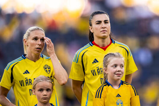 Jonna Andersson and goalkeeper Zecira Musovic of Sweden