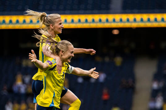Sofia Jakobsson and Magdalena Eriksson of Sweden celebrate