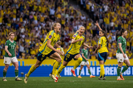 Sofia Jakobsson and Magdalena Eriksson of Sweden celebrate