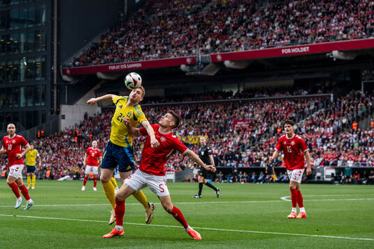 Dejan Kulusevski of Sweden and Joakim Mæhle of Denmark