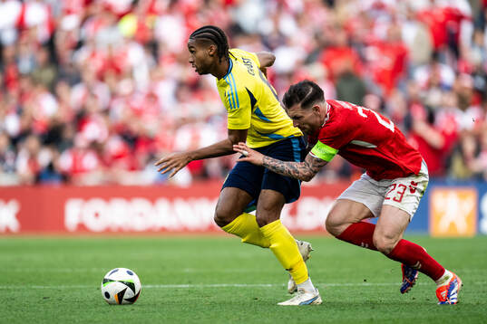 Jens-Lys Michel Cajuste of Sweden and Pierre-Emile