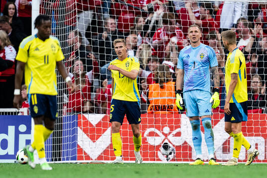 Carl Starfelt and goalkeeper Robin Olsen of Sweden look