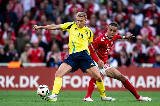 Carl Starfelt of Sweden and Yussuf Poulsen of Denmark
