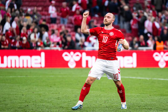 Christian Eriksen of Denmark celebrates