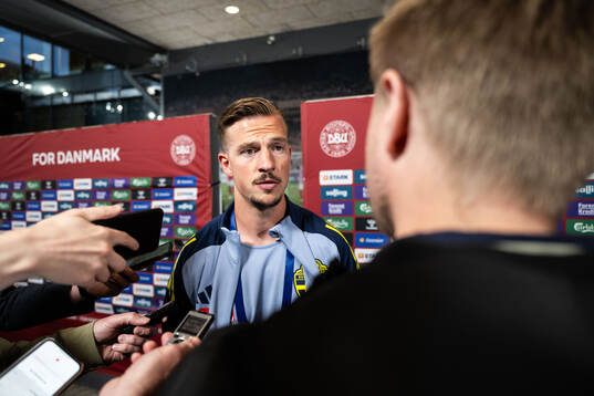 Simon Olsson of Sweden in mixed zone