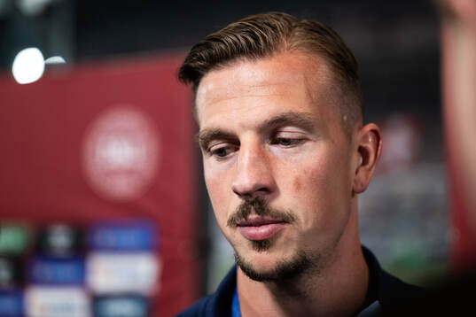 Simon Olsson of Sweden in mixed zone