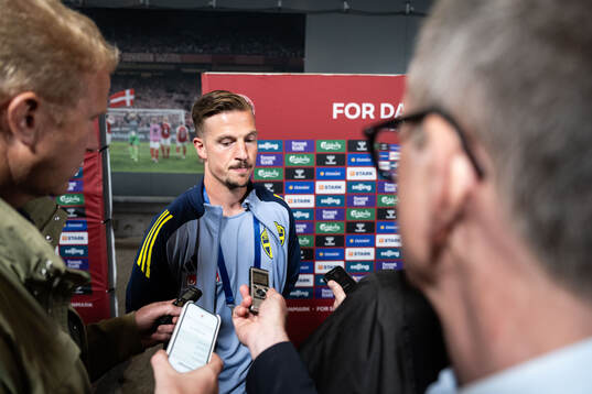 Simon Olsson of Sweden in mixed zone