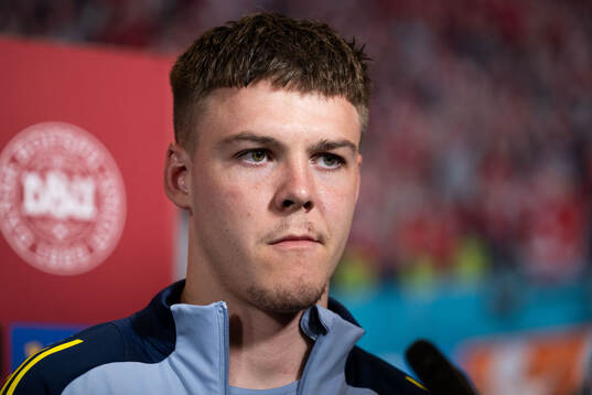 Emil Holm of Sweden in mixed zone