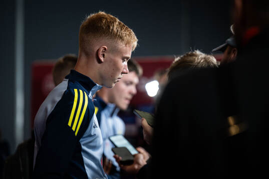 Hugo Larsson of Sweden looks dejected in mixed zone