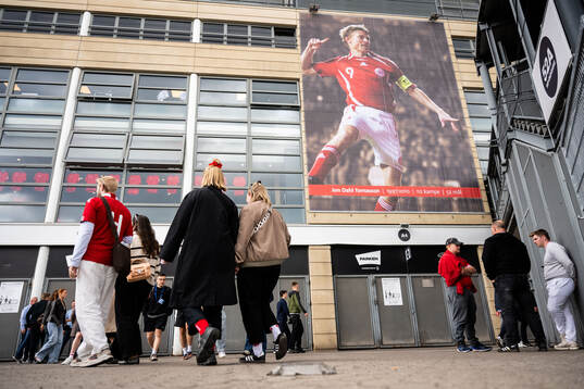 A poster of Jon Dahl Tomasson outside of Parken