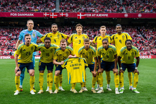 Players of Sweden line up for a team photo with a shirt