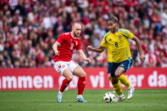 Christian Eriksen of Denmark and Jens-Lys Michel Cajuste of