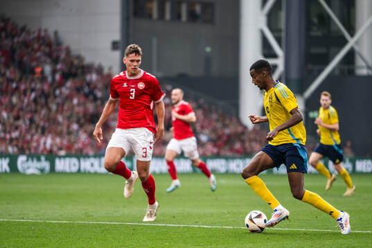 Jannik Vestergaard of Denmark and Alexander Isak of Sweden