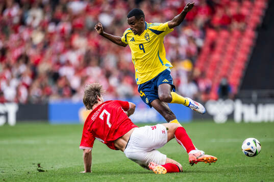 Joachim Andersen of Denmark and Alexander Isak of Sweden