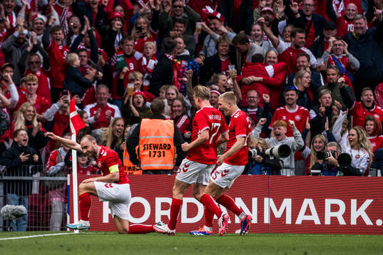 Christian Eriksen of Denmark celebrates