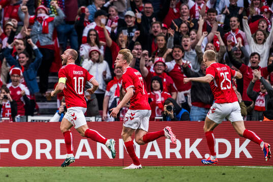 Christian Eriksen of Denmark celebrates
