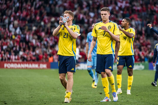 Dejan Kulusevski and Emil Holm of Sweden looks dejected