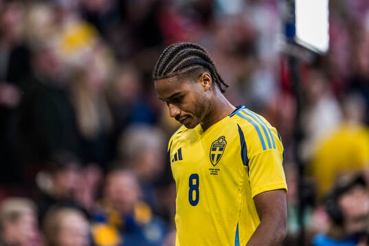 Jens-Lys Michel Cajuste of Sweden looks dejected