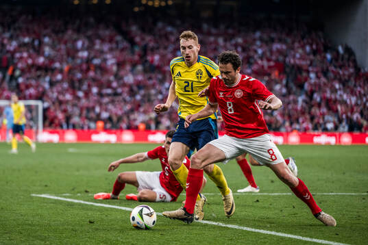 Dejan Kulusevski of Sweden and Thomas Delaney of Denmark