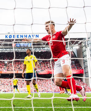 Rasmus Højlund of Denmark celebrate the 1-0 goal  and Isak