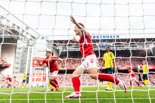 Rasmus Højlund of Denmark celebrate the 1-0 goal  and Isak