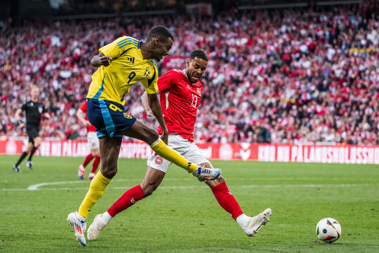 Alexander Isak of Sweden and Mathias Jørgensen of Denmark