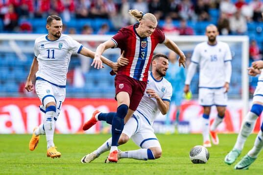 Erling Braut Haaland of Norway against Elbasan Rashani and