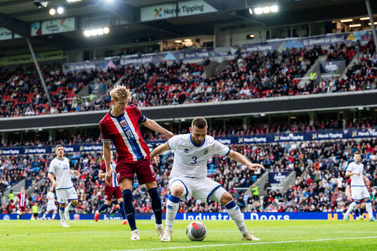 Martin Ødegaard of Norway and Fidan Aliti of Kosovo