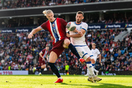 Erling Braut Haaland of Norway and Fidan Aliti of Kosovo