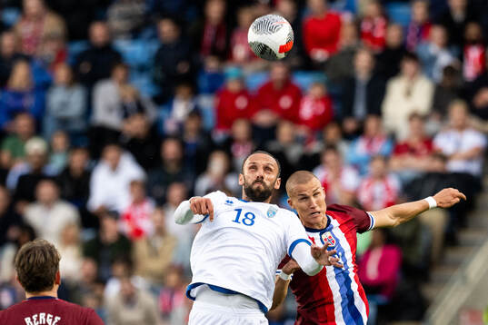 Vedat Muriqi of Kosovo and Leo Østigård of Norway
