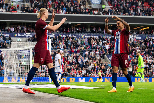 Erling Braut Haaland of Norway celebrates with Antonio Nusa