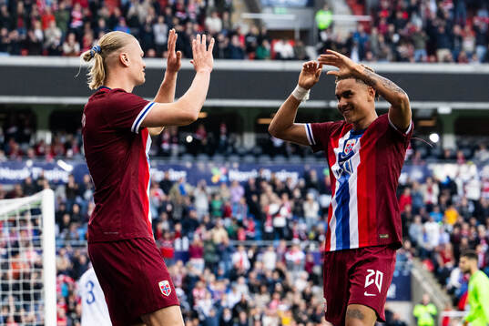 Erling Braut Haaland of Norway celebrates with Antonio Nusa